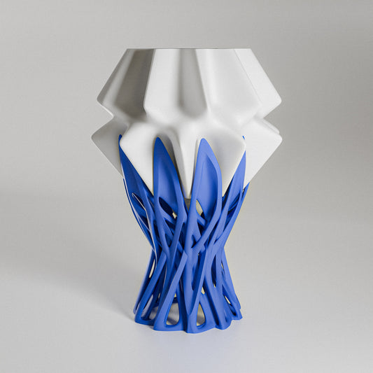White and blue geometric vase on a gray background