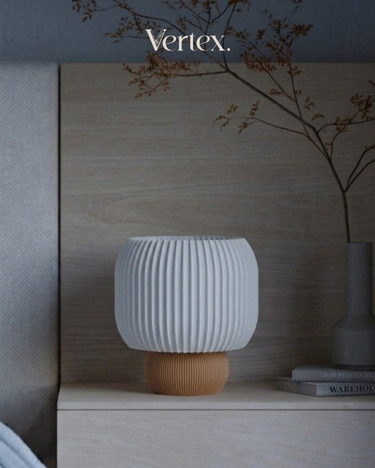 White textured lamp with wooden base on a shelf, 'Vertex' brand visible