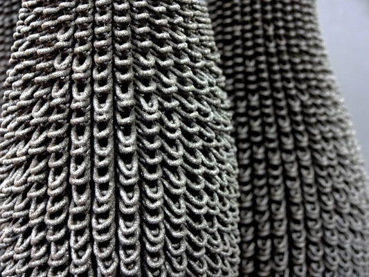 Close-up of a textured fabric with a chain-like pattern.