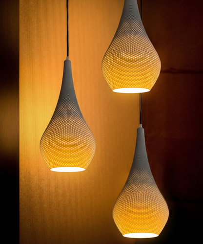 Three hanging pendant lights with a textured design on a warm-toned background
