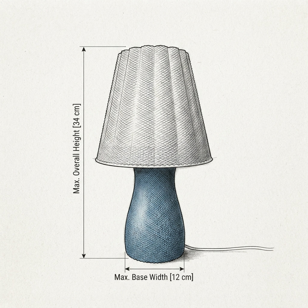 A line-drawn dimension diagram of a table lamp on a light textured background, showing the lampshade height labeled as 34 cm and the base width labeled as 12 cm.