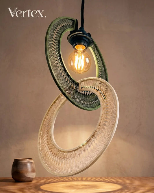 Modern pendant light with 'Vertex' branding on a wooden surface.