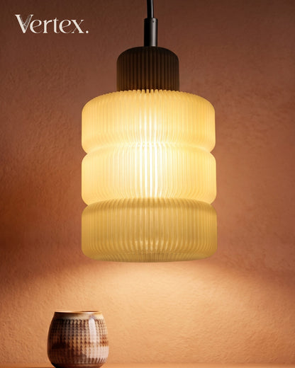 Pendant light with ribbed design on a warm brown background, featuring the brand 'Vertex'.