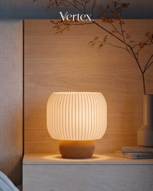 Table lamp on a wooden surface with 'Vertex' branding in the corner.
