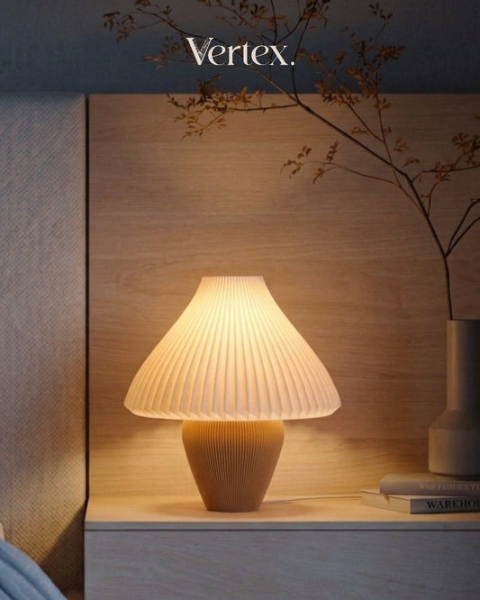 Table lamp on a wooden surface with 'Vertex' branding in the background