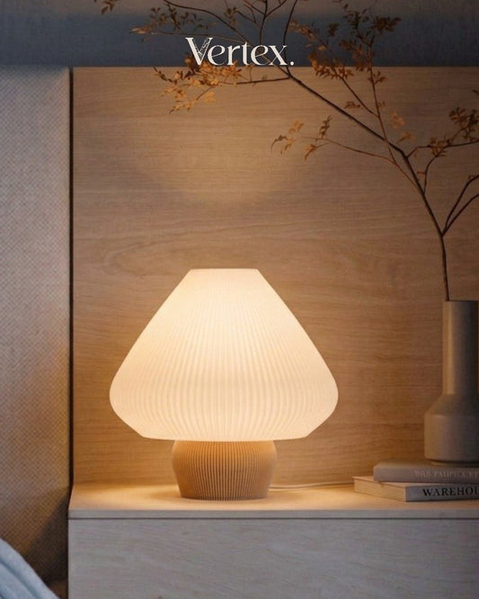 Table lamp on a wooden surface with 'Vertex' branding in the background