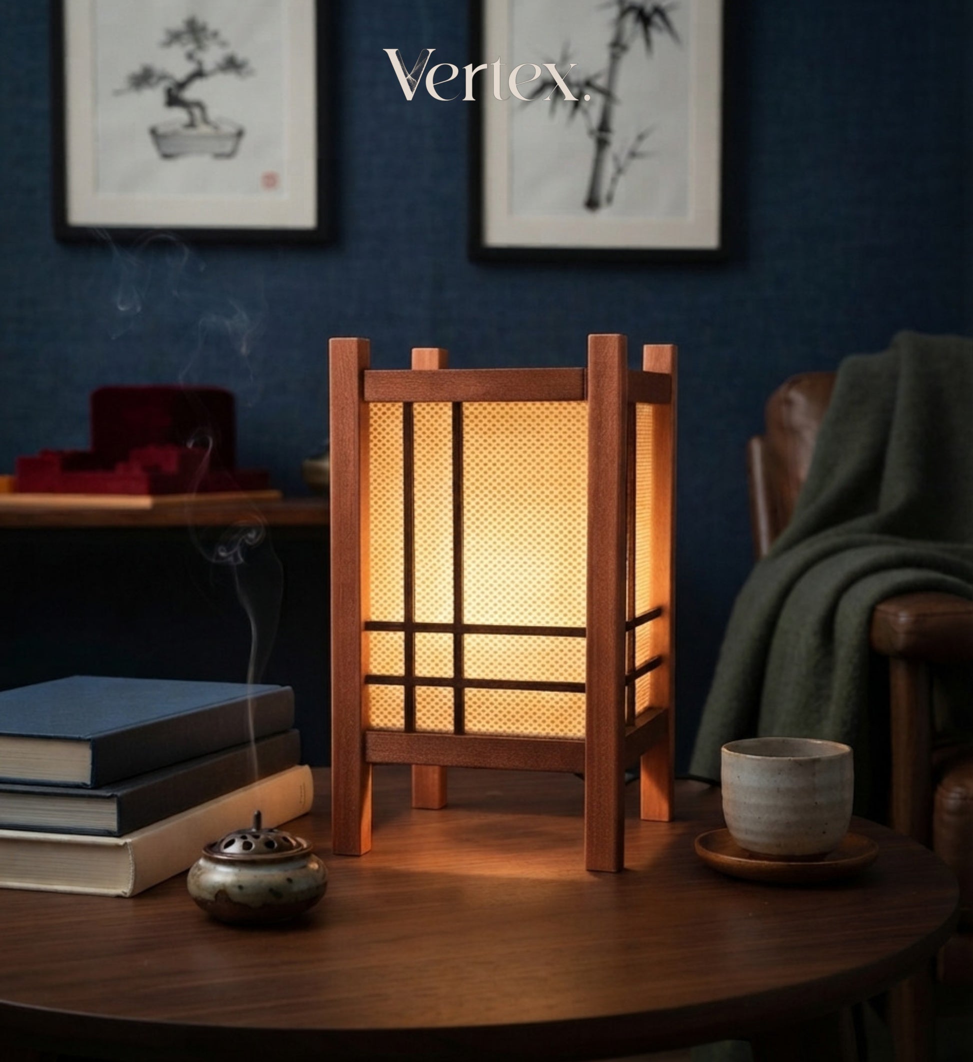 A wooden Japanese-style lantern table lamp with a warm glowing screen, placed on a dark wooden table in a cozy room setting with a cup, incense burner, and books. The brand name 'Vertex' is visible at the top.