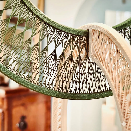 Close-up of a wicker chair with a geometric pattern in a blurred indoor setting