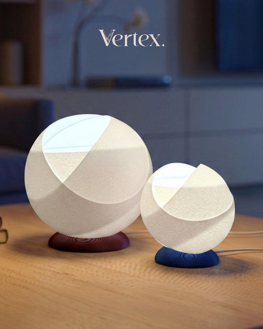 Two spherical lamps with wooden bases on a wooden surface, branded 'Vertex'.