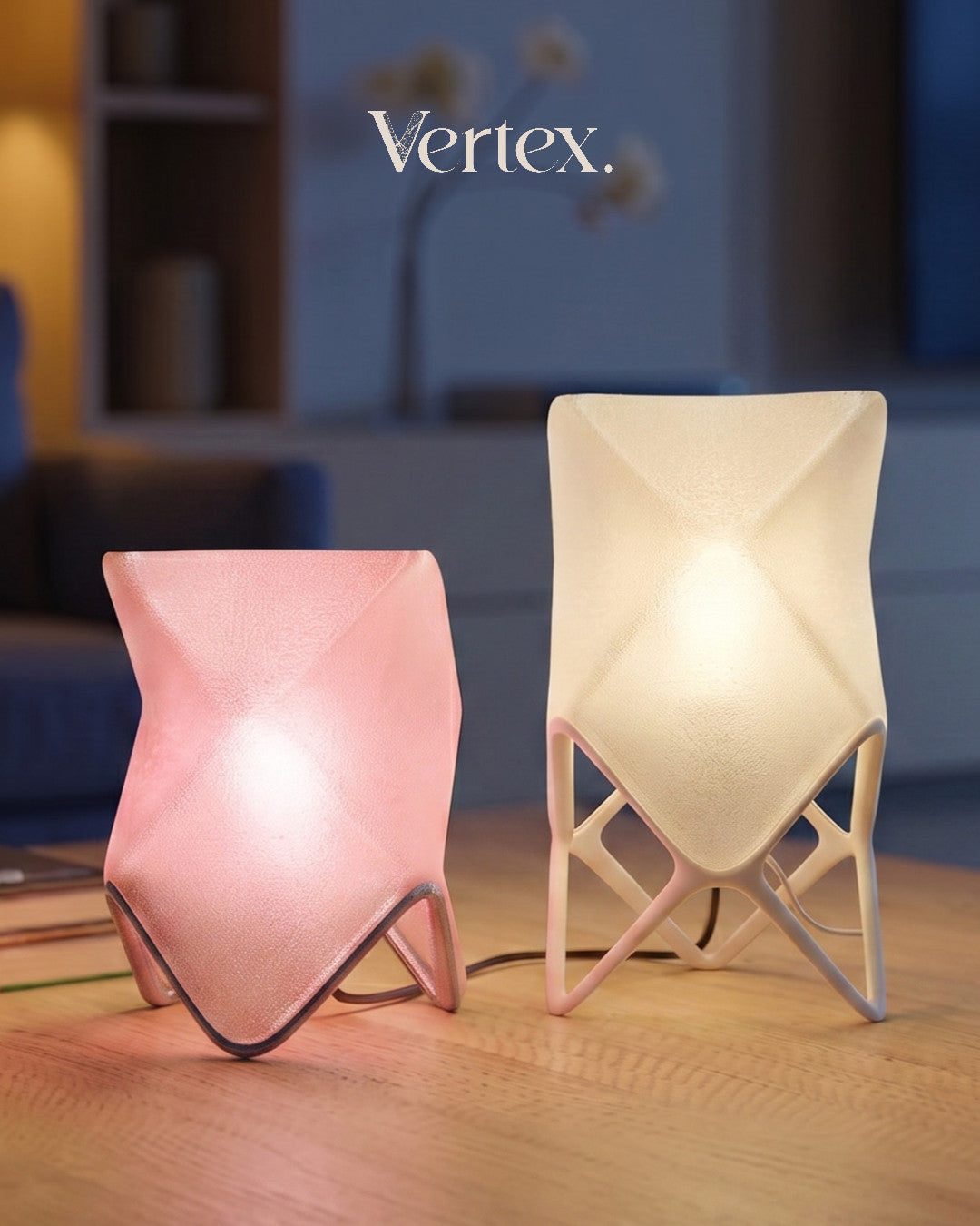 Two modern table lamps, one pink and one white, on a wooden surface with 'Vertex' branding in the background.