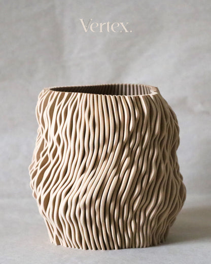 Textured ceramic vase with 'Vertex' branding on a neutral background