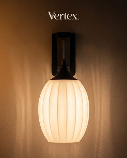 Wall-mounted light fixture with ribbed design on a brown background, featuring the brand 'Vertex'.